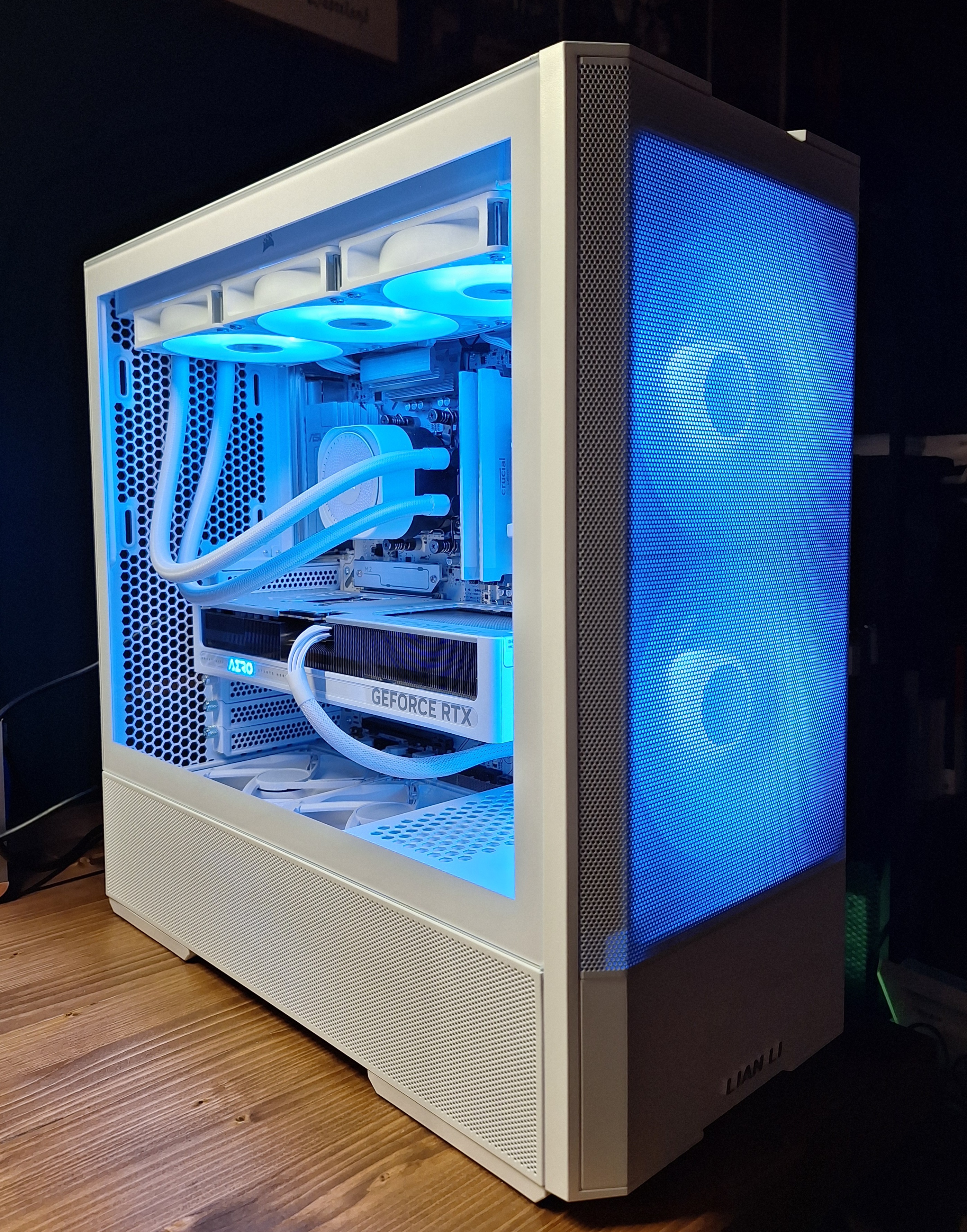 Completed white Lancool 207 gaming PC build on a desk